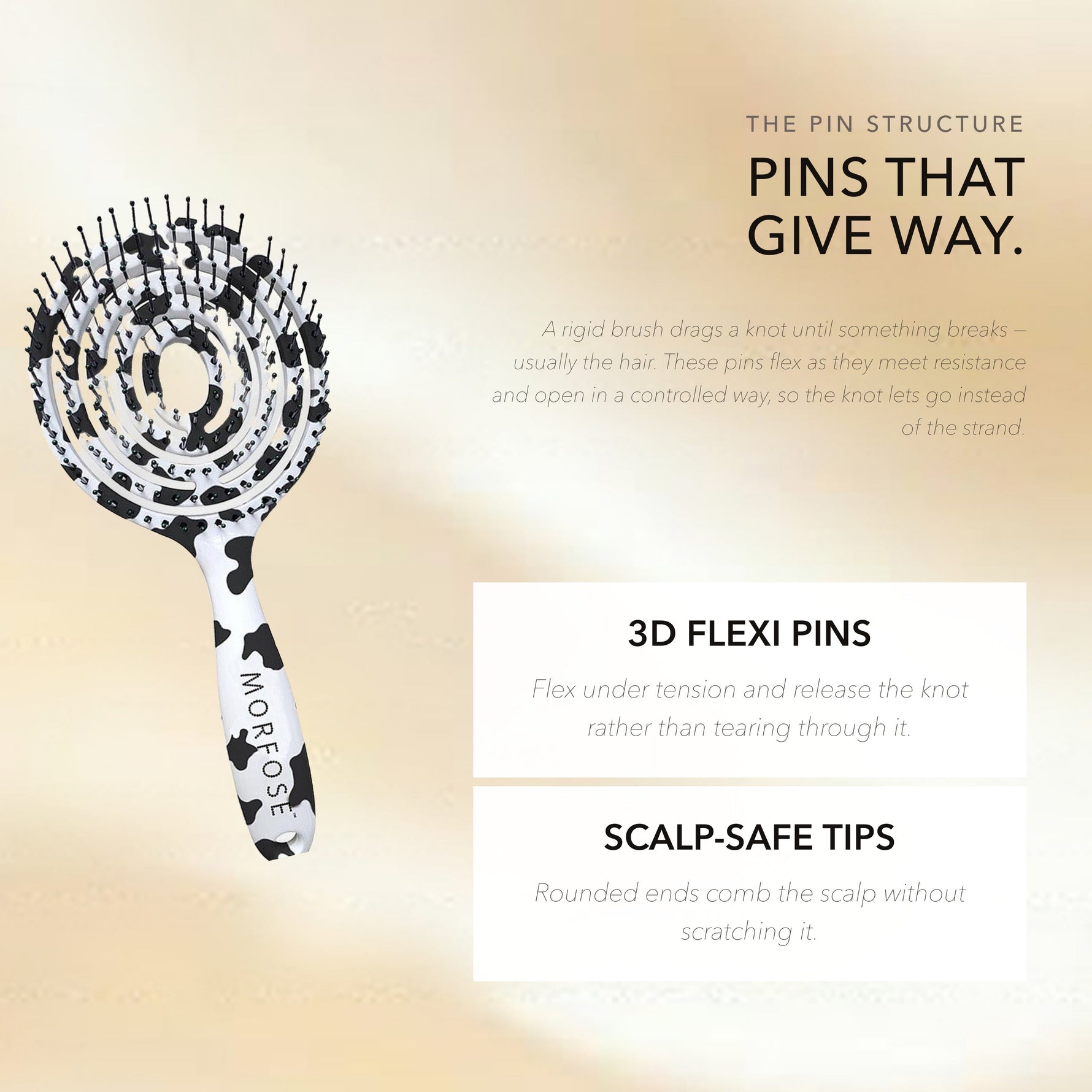 Morfose detangling brush with flexible pins bending under tension against hair