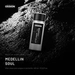 Ossion Medellin Soul After Shave bottle on wet black stone, lit from one side