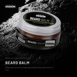 Ossion Beard Balm tin on wet black stone, lit from one side