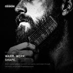 A comb drawn down through a beard shaped with Ossion Beard Balm