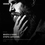 A hand running down through a long soft beard without catching