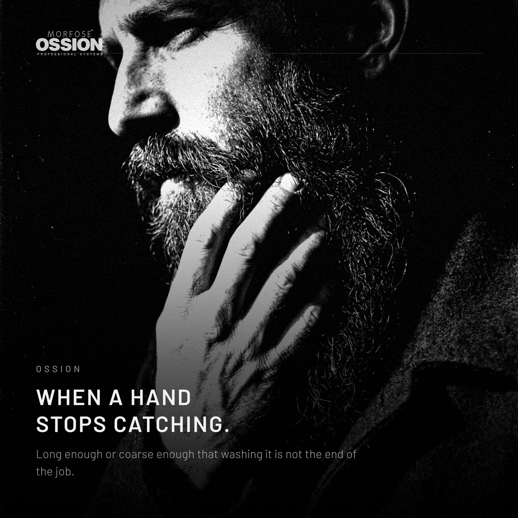 A hand running down through a long soft beard without catching