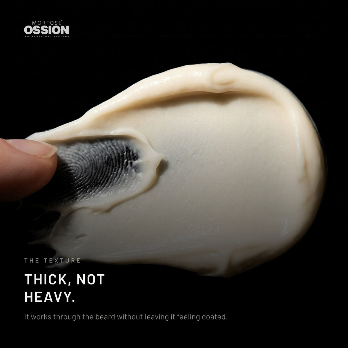 A swipe of Ossion Beard Balsam conditioning cream on black