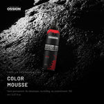 Ossion Color Mousse can on wet black stone, lit from one side