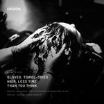 Gloved hands working colour mousse through towel-dried hair
