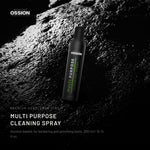 Ossion Cleaning Spray can on wet black stone, lit from one side