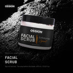 Ossion Face Scrub tub on wet black stone, lit from one side