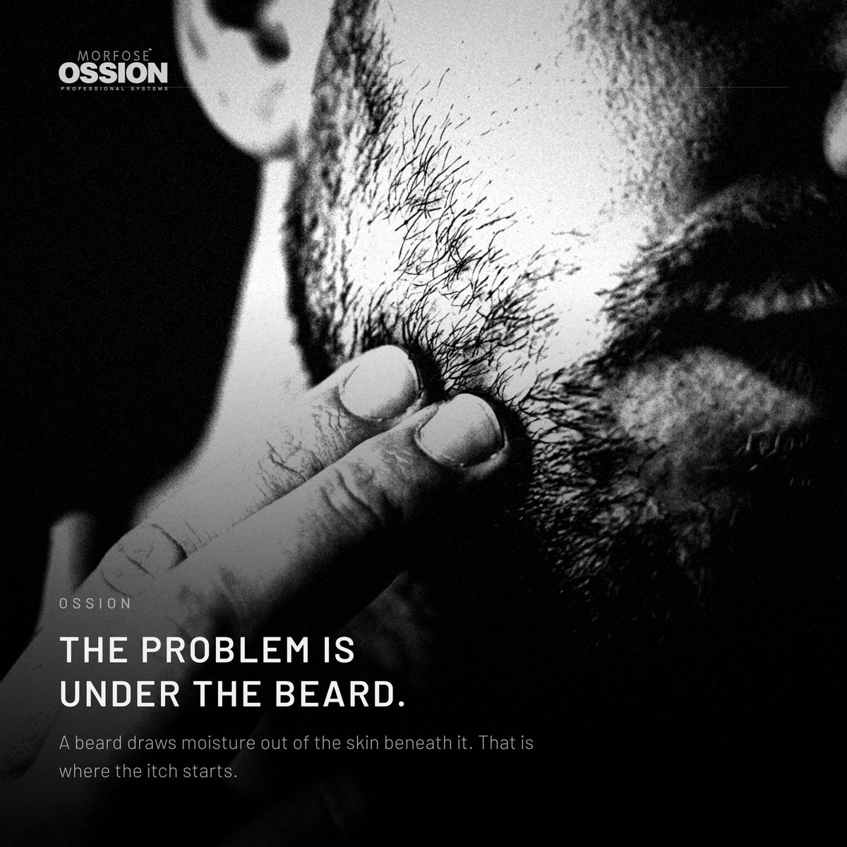 A man's fingers pushing into a short beard down to the skin