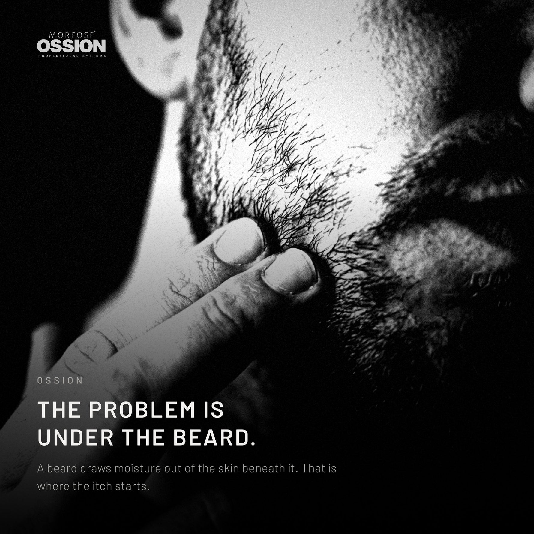 A man's fingers pushing into a short beard down to the skin