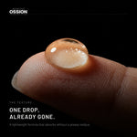 A single drop of Ossion Beard Serum on a fingertip