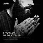 Hands rubbing Ossion Beard Oil before working it into a beard