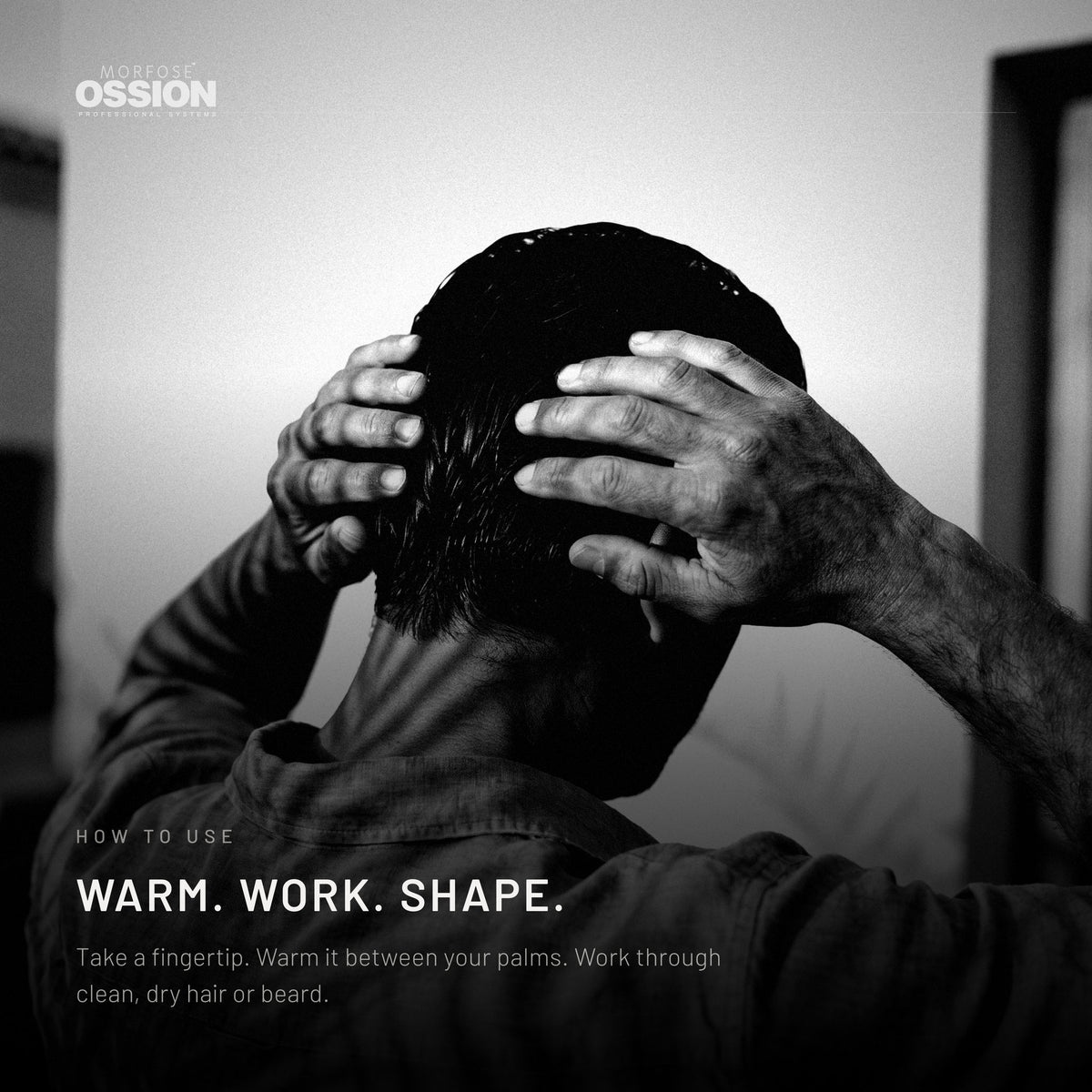 Hands warming Ossion Beard & Hair Cream before working it through dry hair