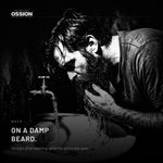 A man washing his beard, the point at which the oil goes on