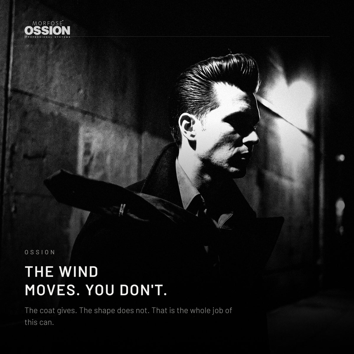 A man's pompadour holding its shape in strong wind