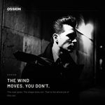 A man's pompadour holding its shape in strong wind