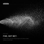 The fine mist of Ossion Hair Spray caught in a beam of light