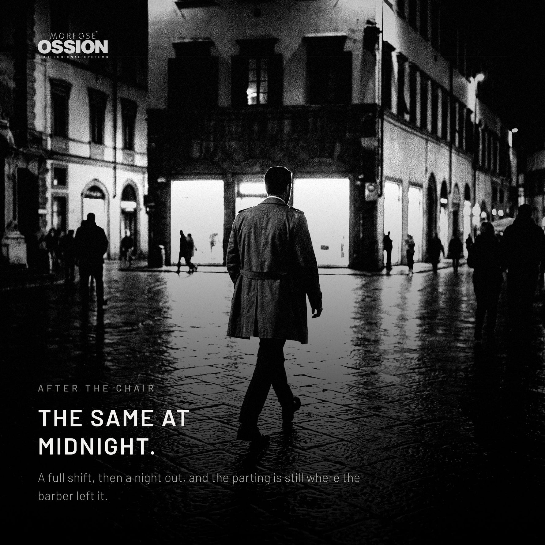 A man crossing a wet city plaza at night, his parting still sharp