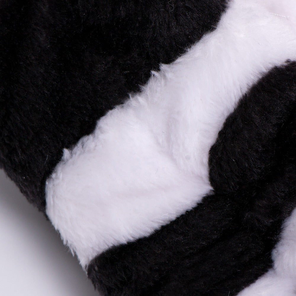 Close-up of the plush cow-print fleece pile on the Morfose spa headband