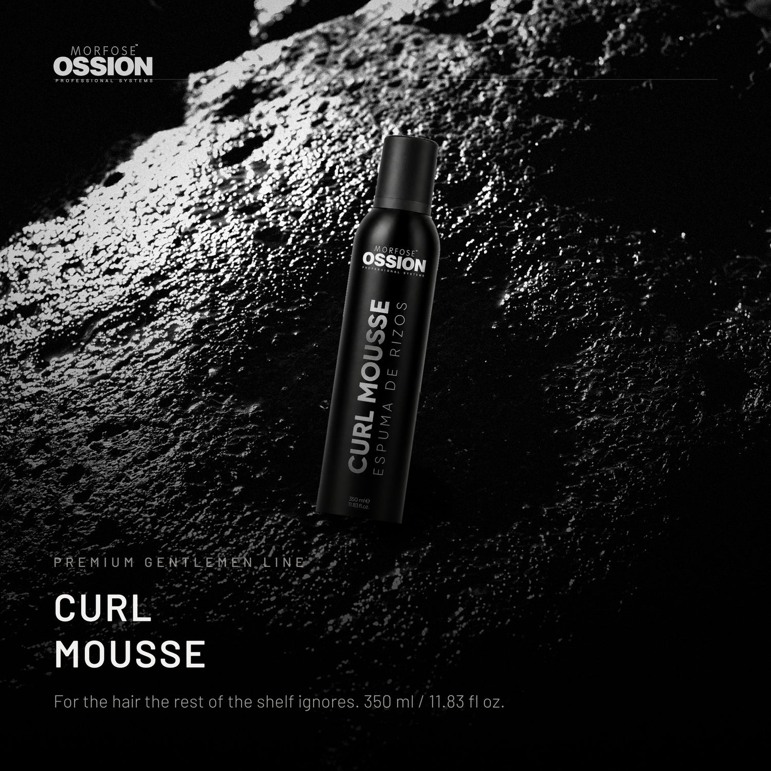 Ossion Curl Mousse can on wet black stone, lit from one side