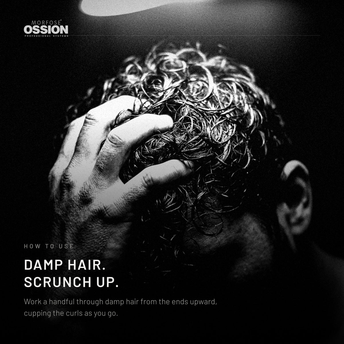 A hand scrunching damp curls upward after applying mousse