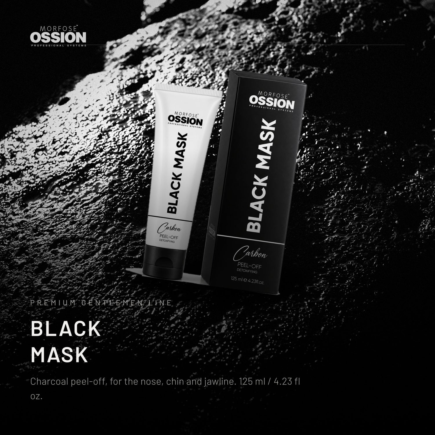 Ossion Black Mask tube on wet black stone, lit from one side
