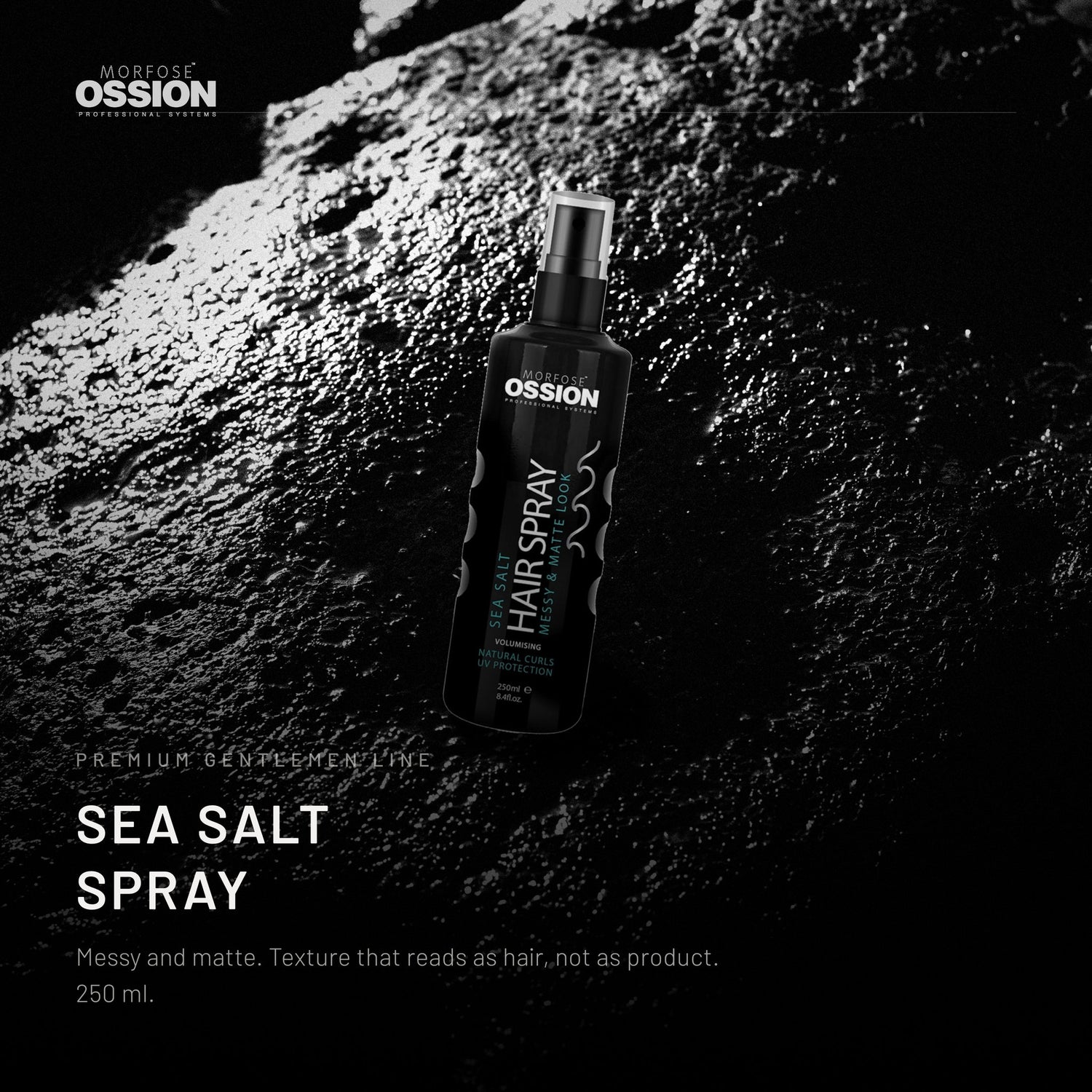 Ossion Sea Salt Spray bottle on wet black stone, lit from one side