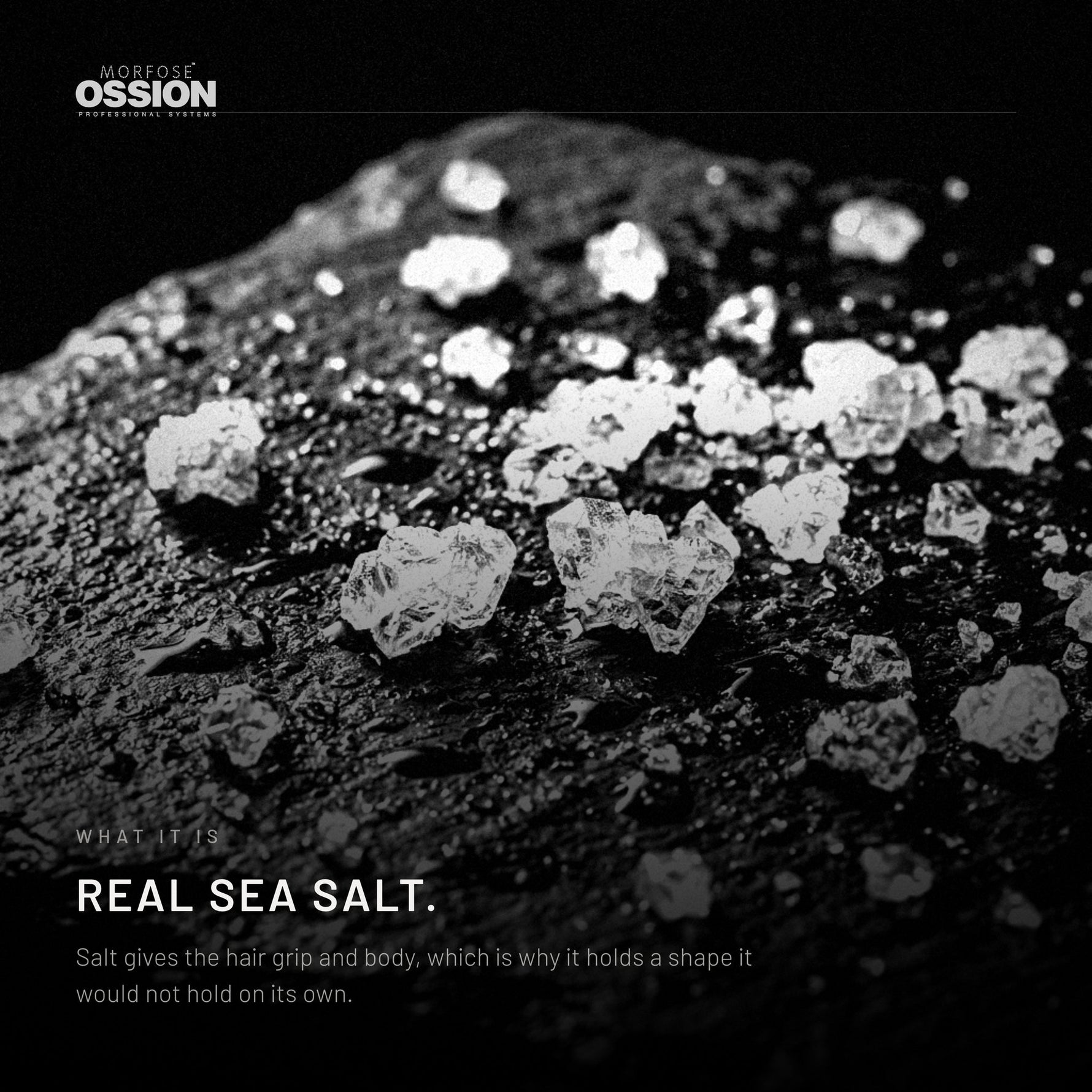 Coarse sea salt crystals on wet dark stone