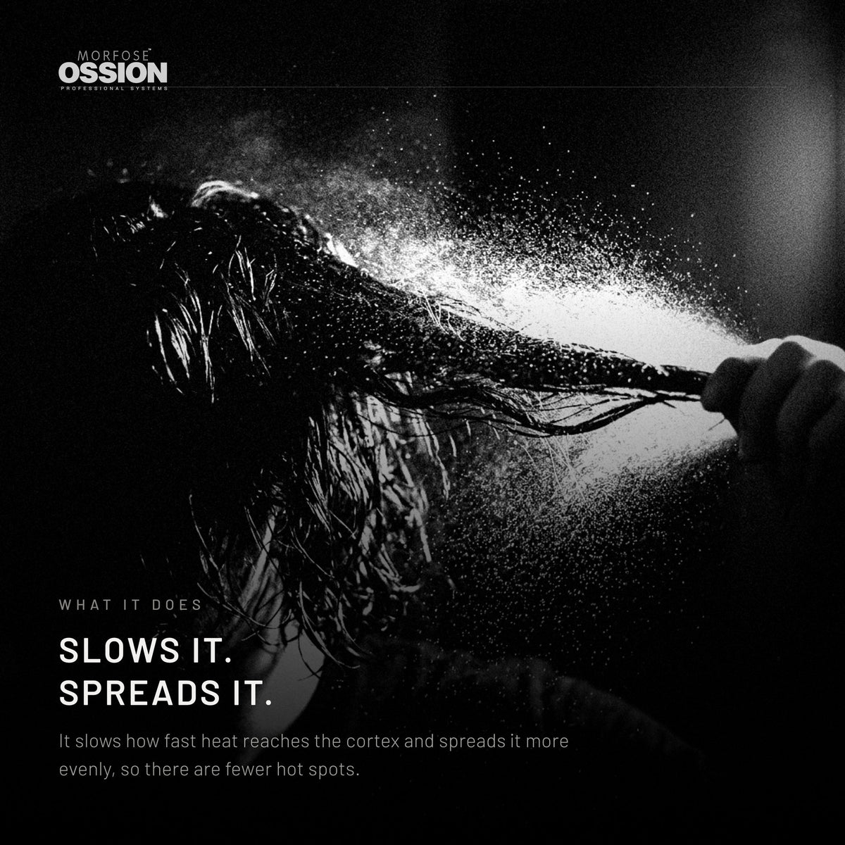 A fine mist of heat protectant settling on a section of hair