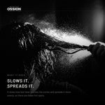 A fine mist of heat protectant settling on a section of hair